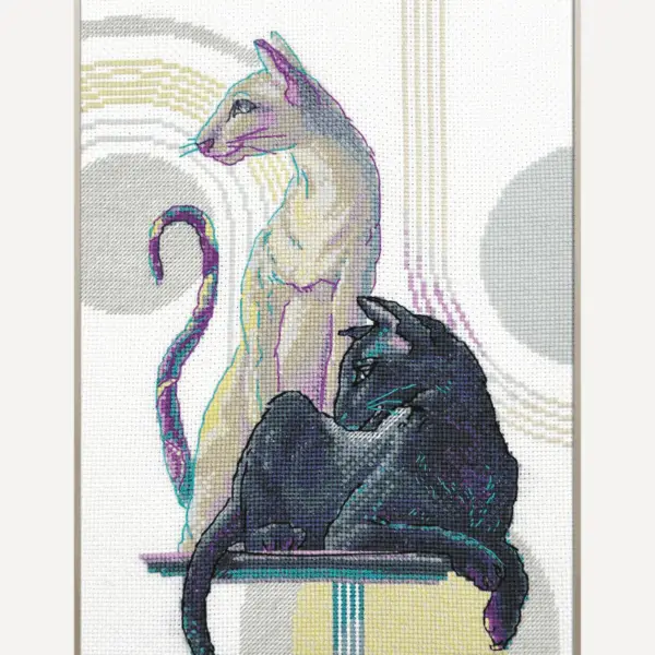 Mystical Cats cross-stitch kit showing a black cat and a cream cat on a modern background, embroidery design by Aine.