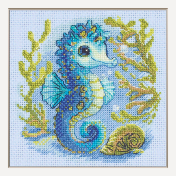 Baby Sea Horse cross stitch kit showing a blue baby seahorse underwater with golden seaweed and a shell.
