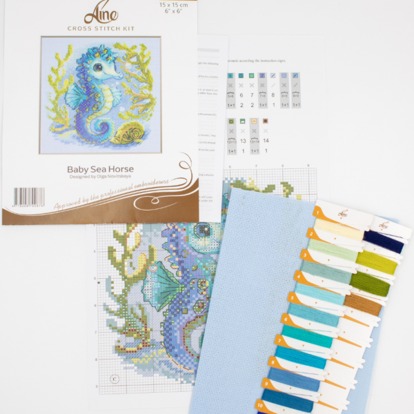 Baby Sea Horse cross stitch kit showing a blue baby seahorse underwater with golden seaweed and a shell.