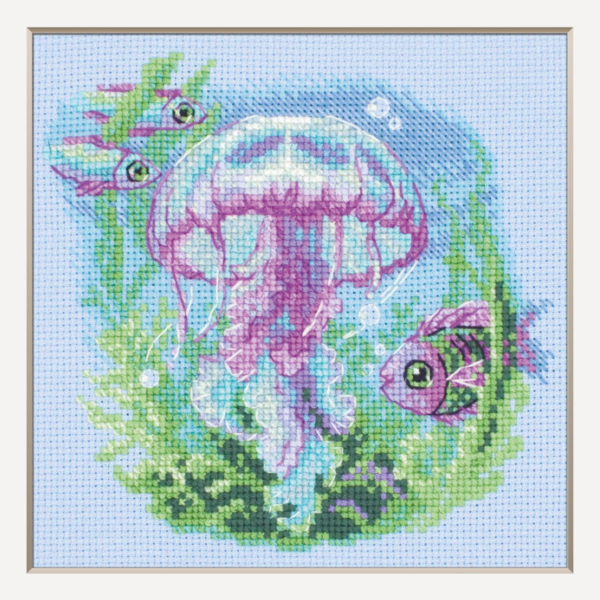 Baby Jellyfish cross stitch kit showing a pink and purple jellyfish underwater with green sea plants, bubbles, and three fish.
