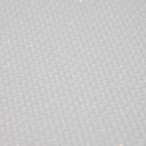 Close-up of Zweigart 14 count White Opalescent Aida-Star fabric showcasing its standard evenweave grid and shimmering iridescent metallic threads.