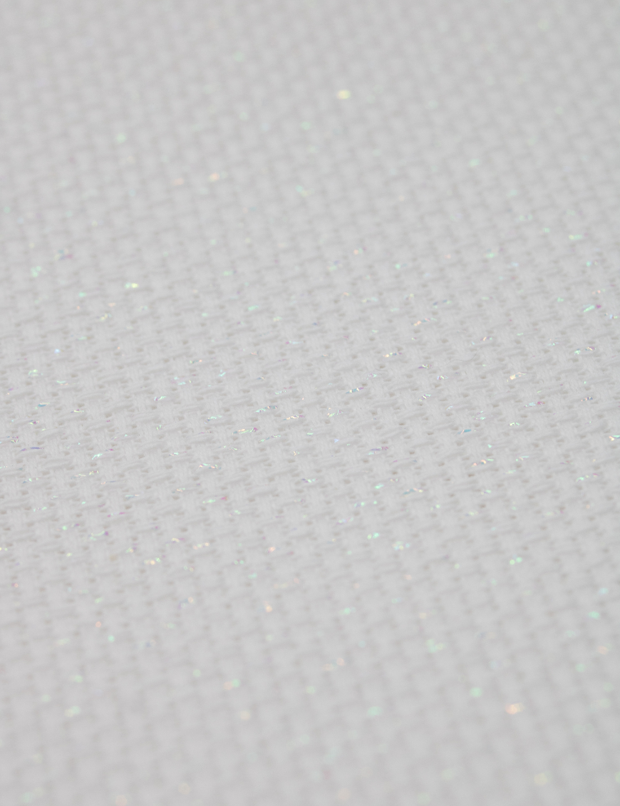 Close-up of Zweigart 14 count White Opalescent Aida-Star fabric showcasing its standard evenweave grid and shimmering iridescent metallic threads.