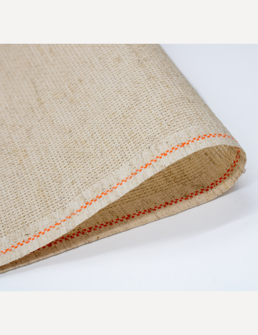 Close-up of Zweigart 10 count Rustico Aida fabric showcasing its easy-to-stitch evenweave grid and natural, earthy flecked appearance.