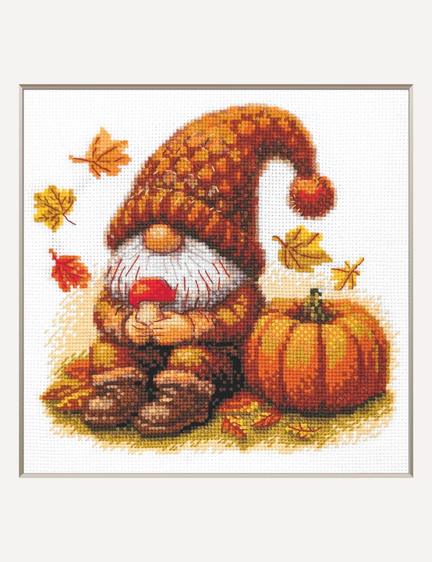 A1044 Harvest Gnome Aine Cross-Stitch Kit featuring an autumn gnome with a large orange pumpkin, colorful fall leaves, and a tiny red mushroom.