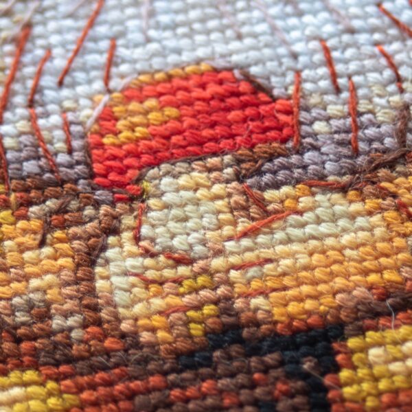 A1044 Harvest Gnome Aine Cross-Stitch Kit featuring an autumn gnome with a large orange pumpkin, colorful fall leaves, and a tiny red mushroom.