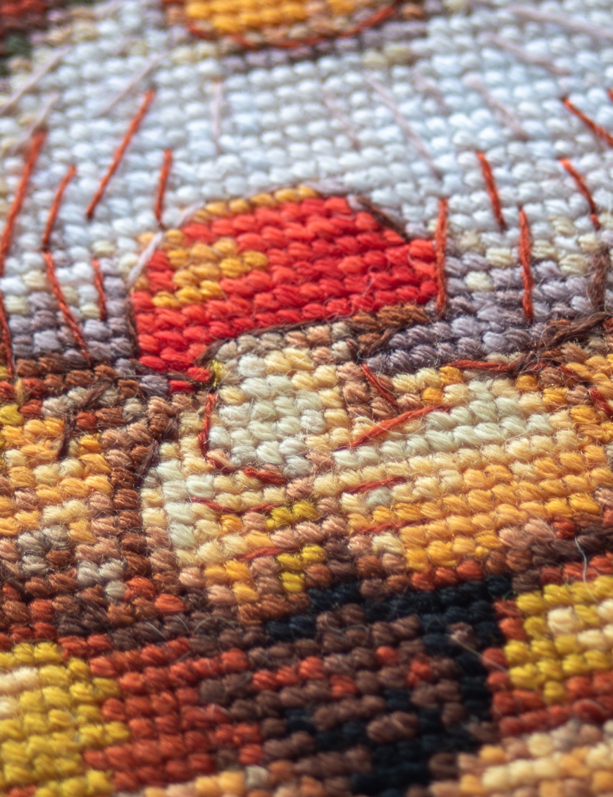 A1044 Harvest Gnome Aine Cross-Stitch Kit featuring an autumn gnome with a large orange pumpkin, colorful fall leaves, and a tiny red mushroom.